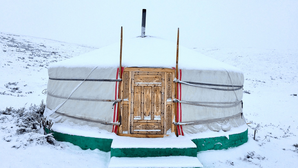 A ger, a Mongolian tent, coverd in snow during the winter in Mongolia